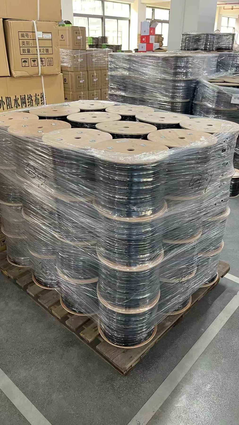 Finished cable reels organized in the warehouse