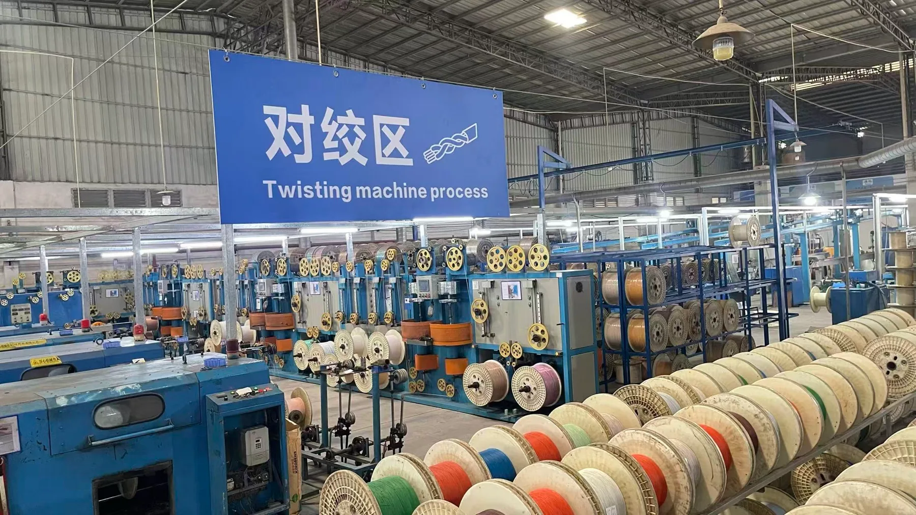 Cable twisting equipment operating on the factory floor
